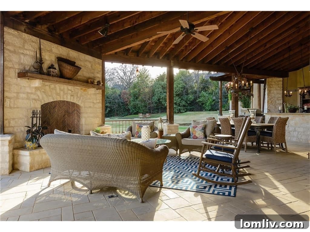 Expansive outdoor living area overlooking the pool and gardens, designed for relaxation