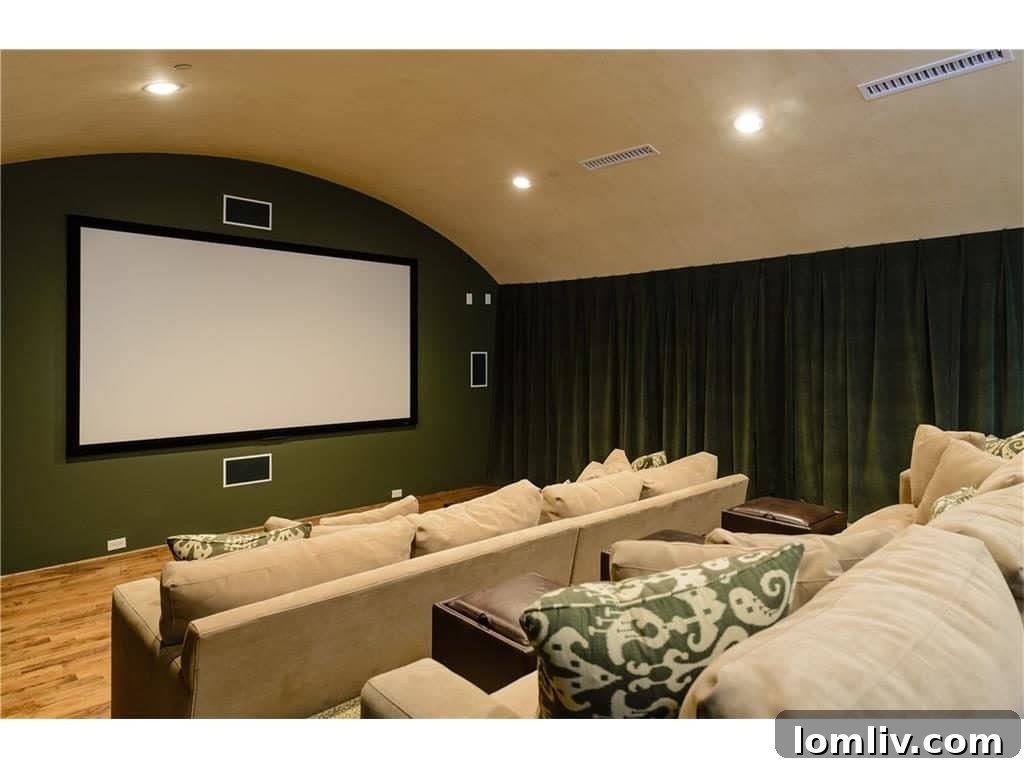Dedicated home media theater room for entertainment, featuring comfortable seating