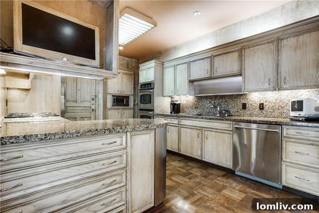 Renovated kitchen in an Imperial House unit, Pink Wall, Dallas, priced at $185 per square foot.