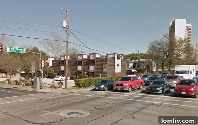 The Laurel Apartments before renovation, showing dated exterior in Pink Wall, Dallas.