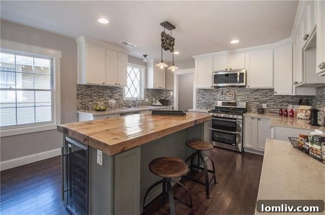 Custom kitchen with oversized island and solid-surface counters