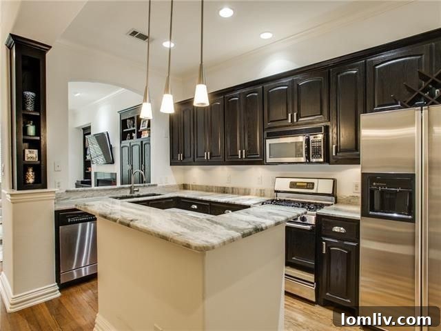 Sleek kitchen with exotic granite countertops and modern appliances