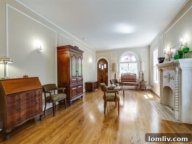 Charming living room with original fireplace in the Old East Dallas Tudor