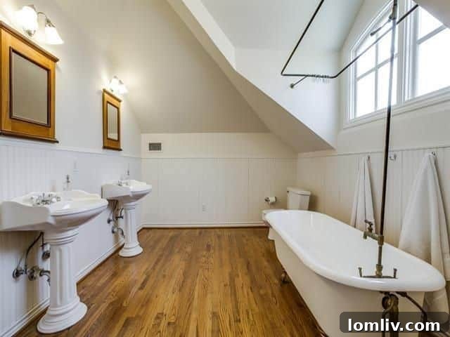 Spacious master bathroom with arched ceiling in the Old East Dallas Tudor