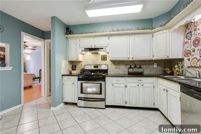 Detail of gas range and stylish kitchen cabinetry