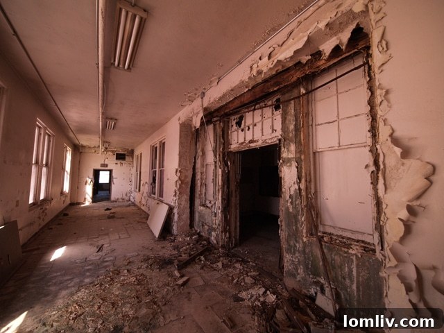 Entrance facade of Parkland Hospital in disrepair