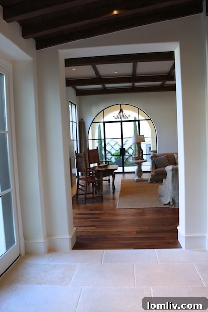 3608-Beverly-Dr-23 - French limestone floors lead to the great room and outdoor courtyard.