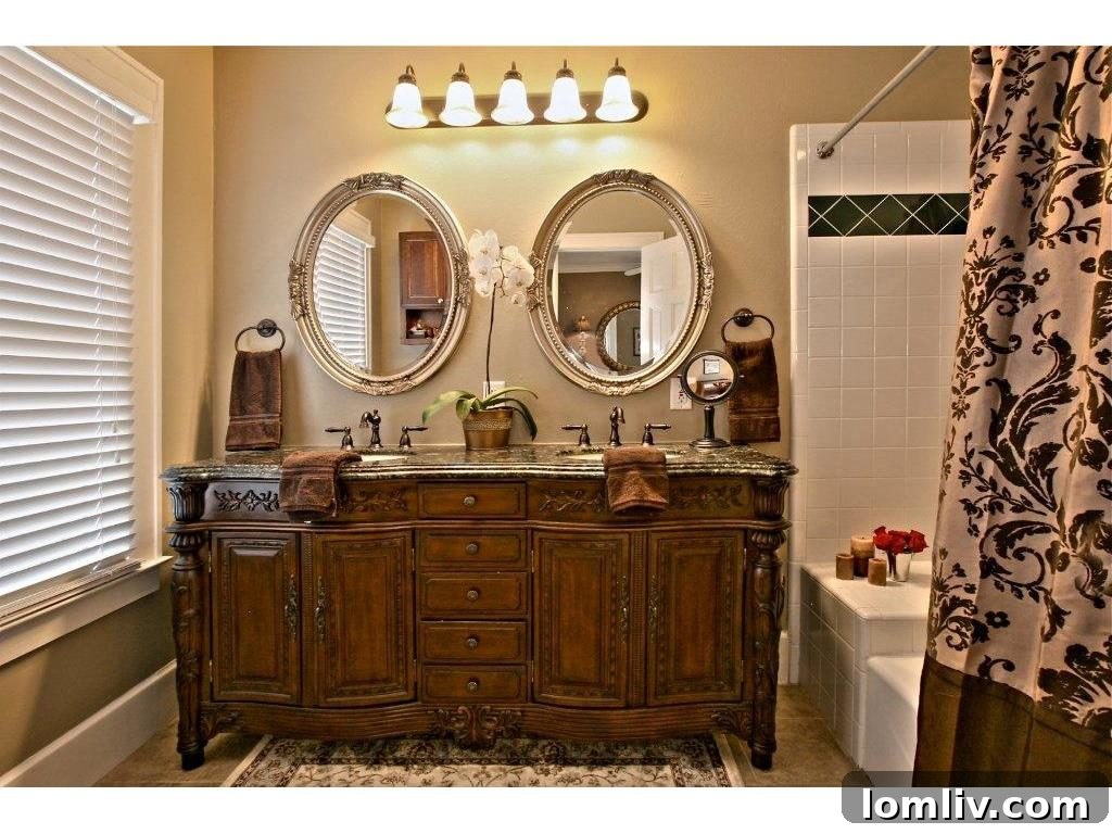 Iconic 1925 M Streets Prairie Craftsman: Timeless Charm, Ready for You 12 Before renovation: Dated master bathroom vanity, tile, lights, and mirrors