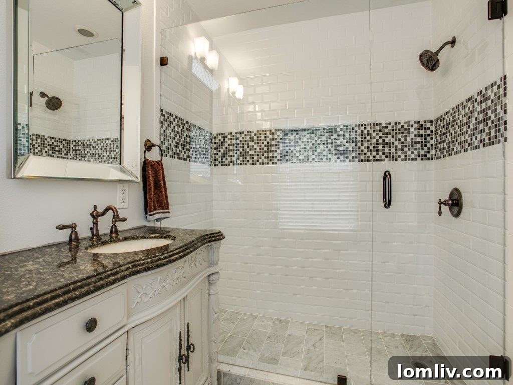 Iconic 1925 M Streets Prairie Craftsman: Timeless Charm, Ready for You 13 Luxuriously updated master bathroom with frameless shower and new fixtures