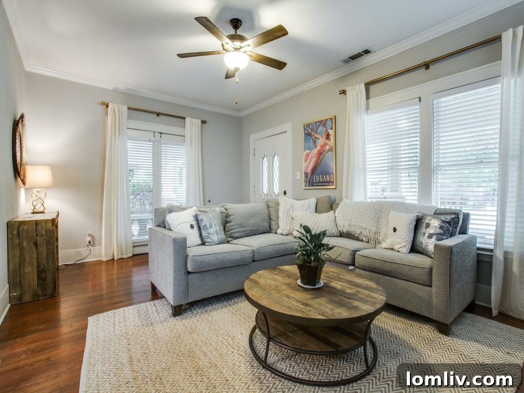 Iconic 1925 M Streets Prairie Craftsman: Timeless Charm, Ready for You 6 Elegant French doors connect the living area to the spacious wrap-around porch