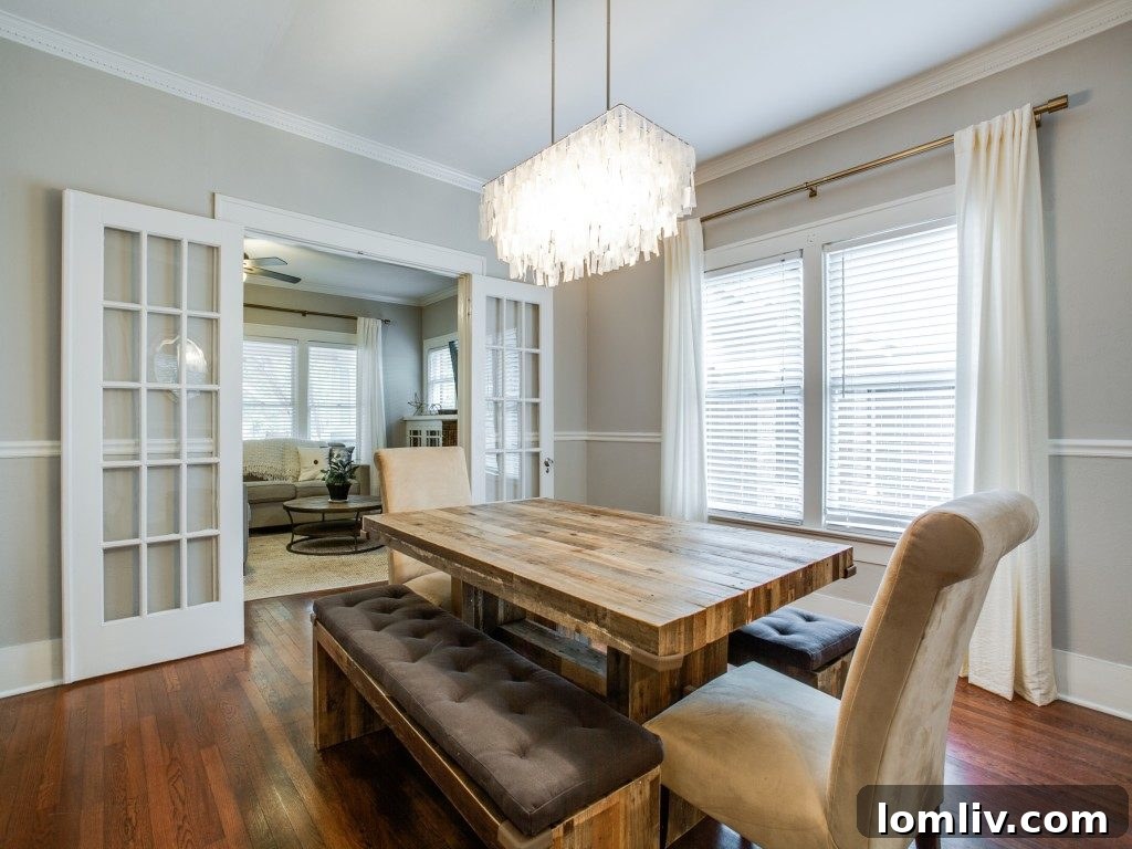 Iconic 1925 M Streets Prairie Craftsman: Timeless Charm, Ready for You 7 Bright and airy living room with classic M Streets charm and modern touches