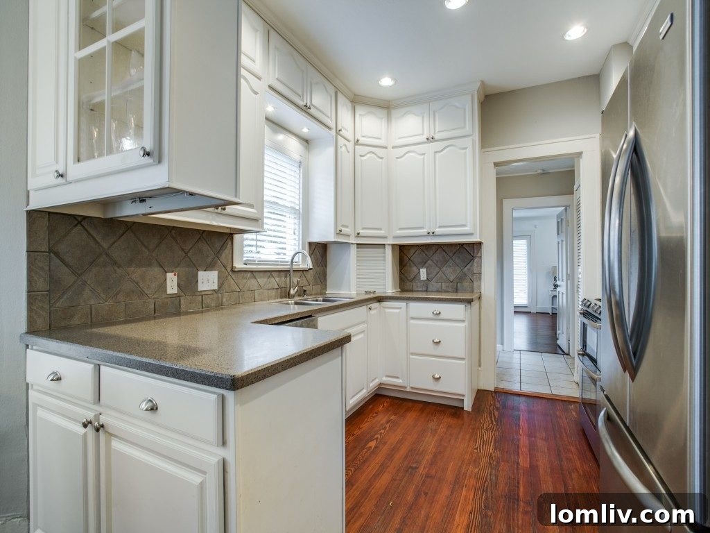 Iconic 1925 M Streets Prairie Craftsman: Timeless Charm, Ready for You 9 View of the open concept kitchen featuring elegant hardwood floors