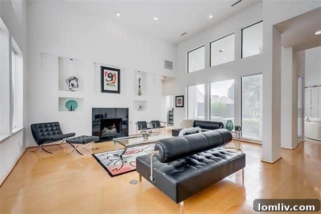 Dramatic curved stairway and soaring 20-foot ceilings in Bob Bobbit Contemporary