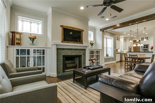 Open-concept living room with hardwood floors and exposed beams
