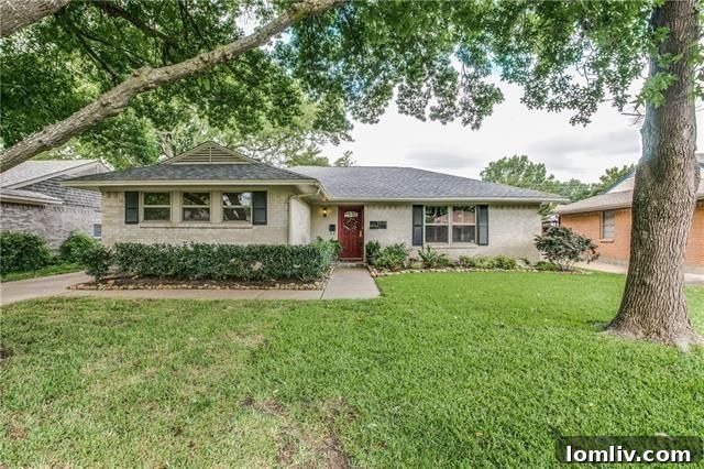 Inviting facade of 9615 Lanward Dr in L-Streets with well-manicured lawn