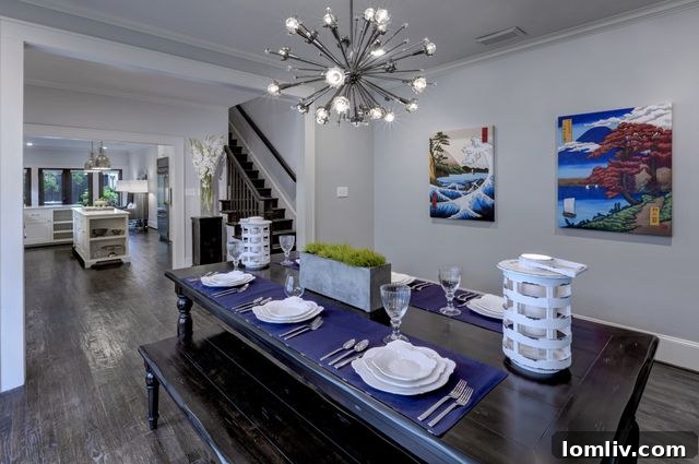 Elegant dining room with designer lighting and crown molding in 5829 Belmont Ave