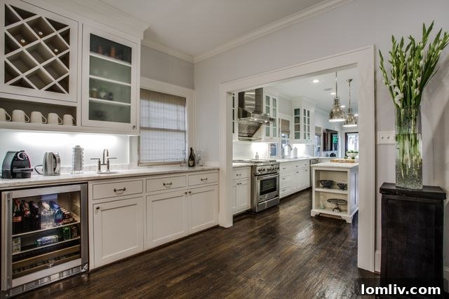 Spacious living area with modern furnishings and custom lighting in the East Dallas Craftsman