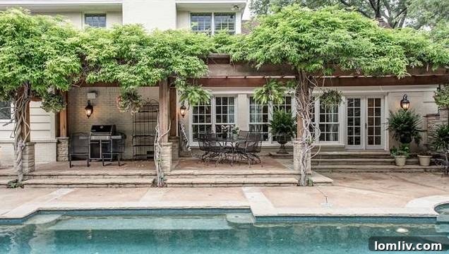Expansive backyard with a fully equipped workshop and mature trees