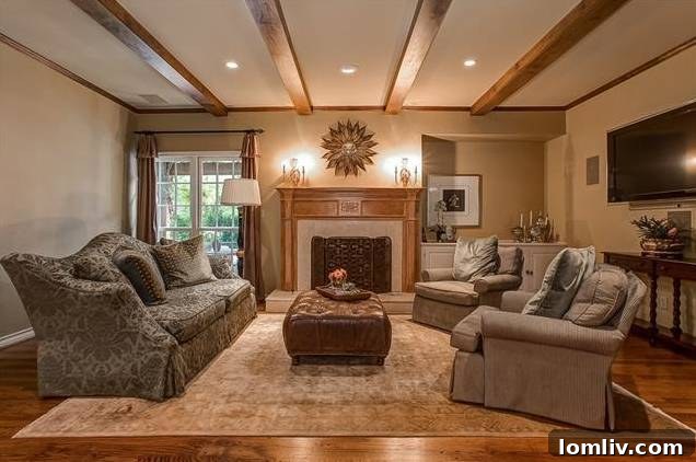 Dignified living room with wood-burning fireplace and beamed ceiling