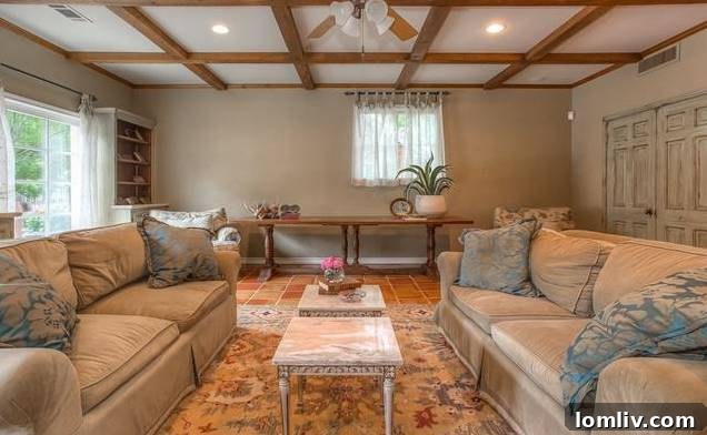 Airy family living area with terracotta tiles and French Provincial influences