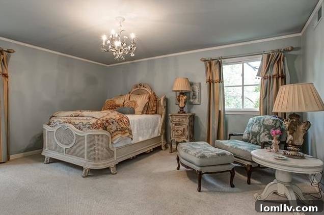 Serene ground-floor bedroom with slate blue walls and private bath