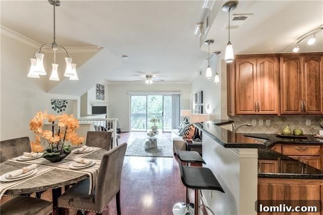 Modern kitchen with elegant granite countertops and stainless steel appliances in Dallas condo