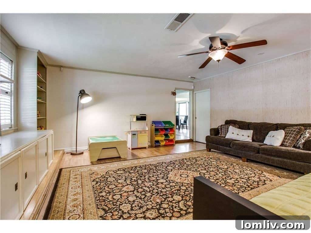 Converted garage space at 4939 Harvest Hill, now a versatile room for family needs.