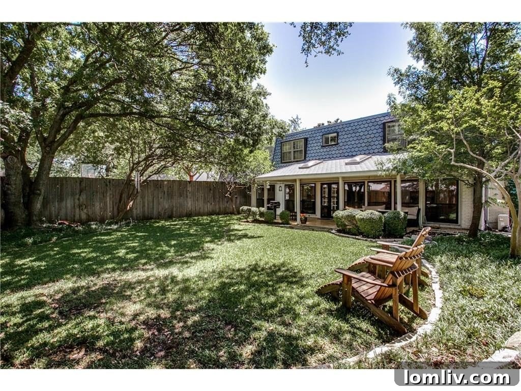 Exterior rear of 4939 Harvest Hill, showing the ample space for outdoor activities.