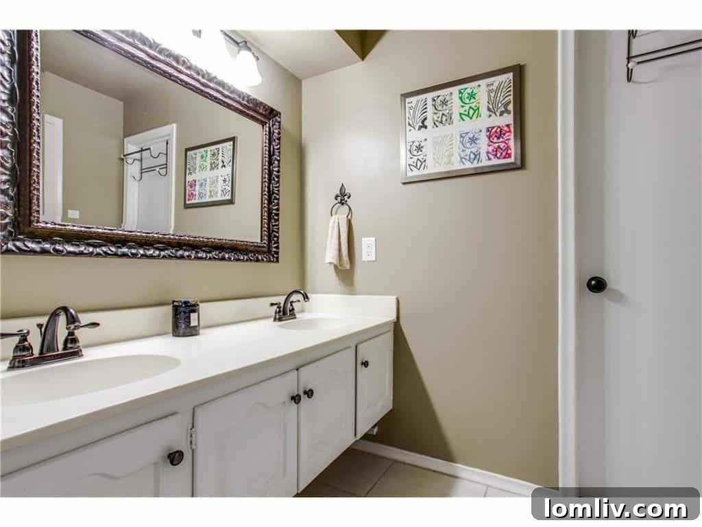 Spacious children's bathroom with dual sinks, perfect for families.