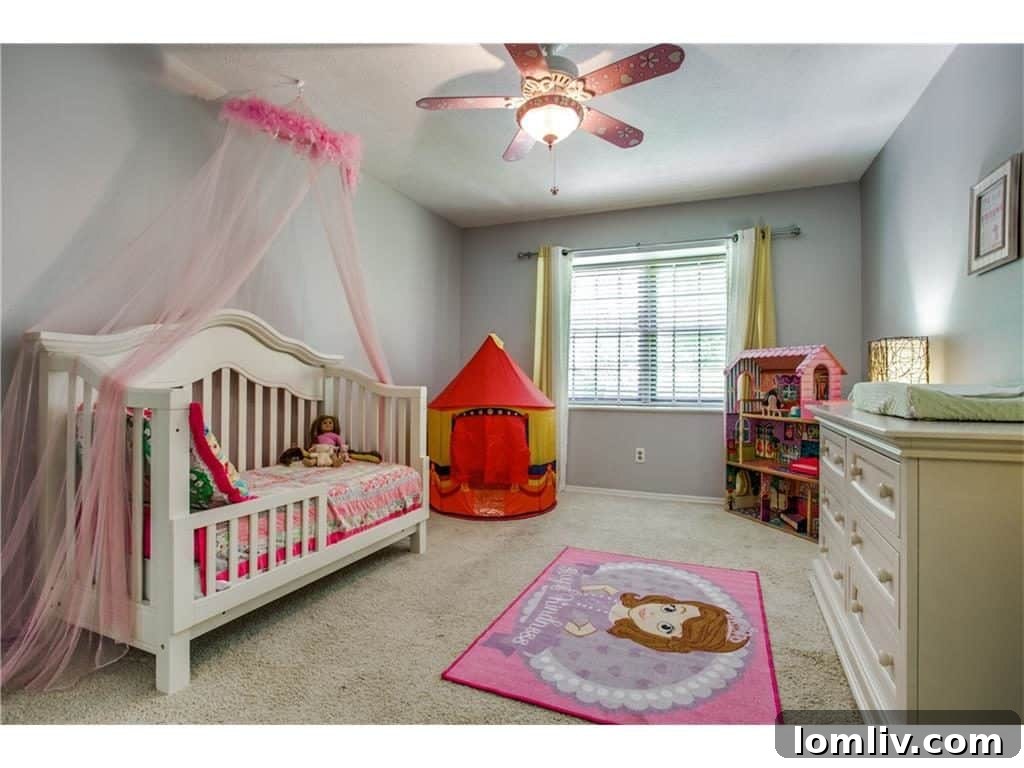 One of the comfortable upstairs bedrooms at 4939 Harvest Hill, bright and inviting.