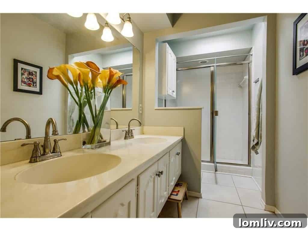 Stylish second bathroom upstairs, well-maintained and ready for use.