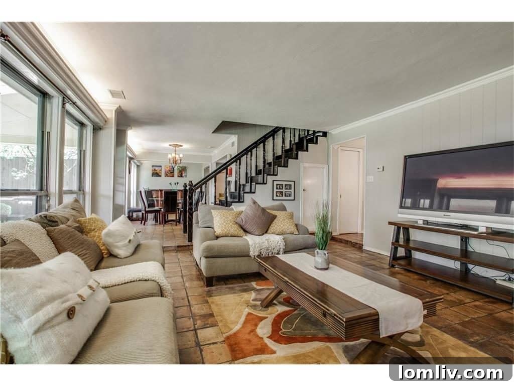 Elegant staircase inside 4939 Harvest Hill, leading to the private upstairs living quarters.