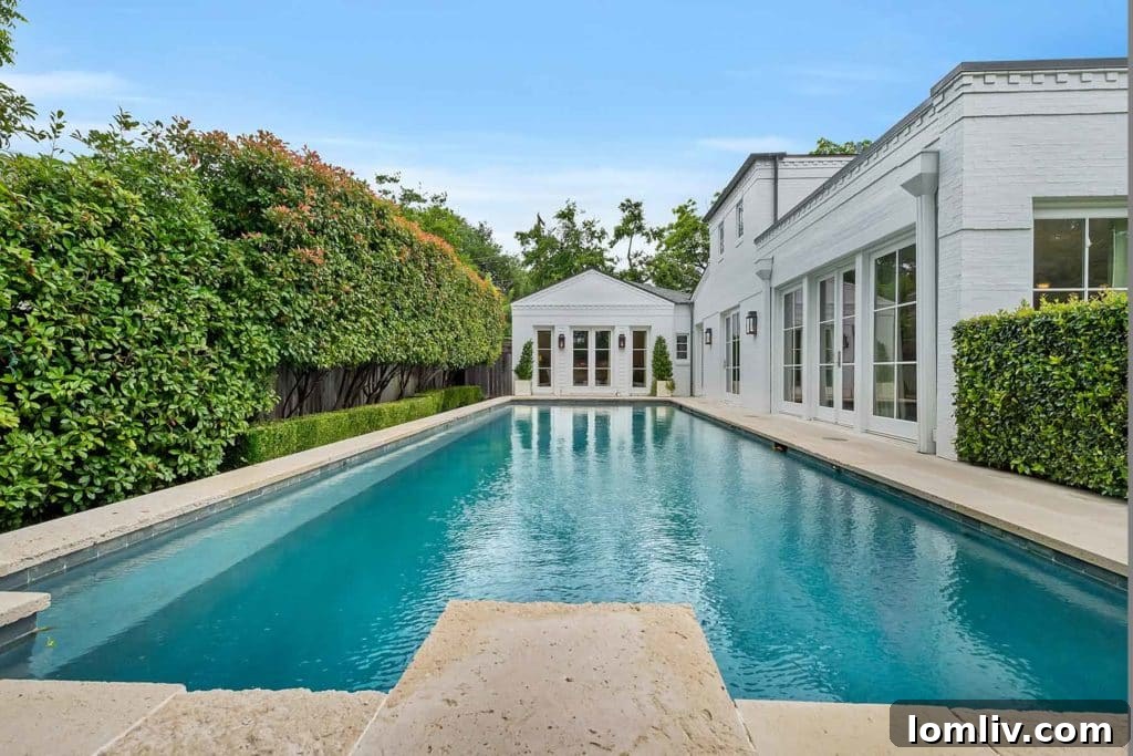 Private outdoor pool area with mature landscaping at 300 Crestwood Drive