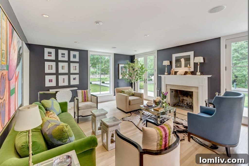 Chic living room with sophisticated aubergine walls by Julie Hayes