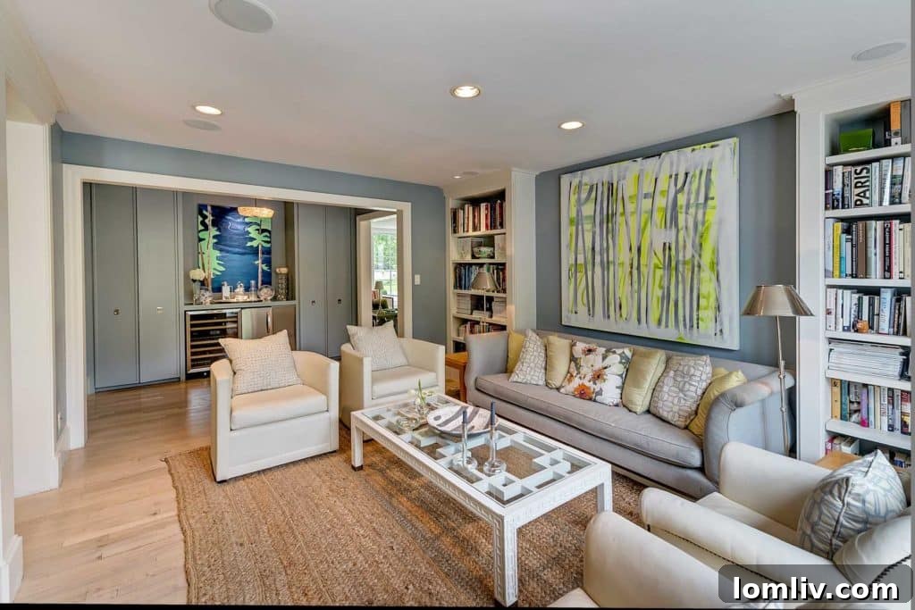 Glamorous sitting room with bar area and custom built-ins