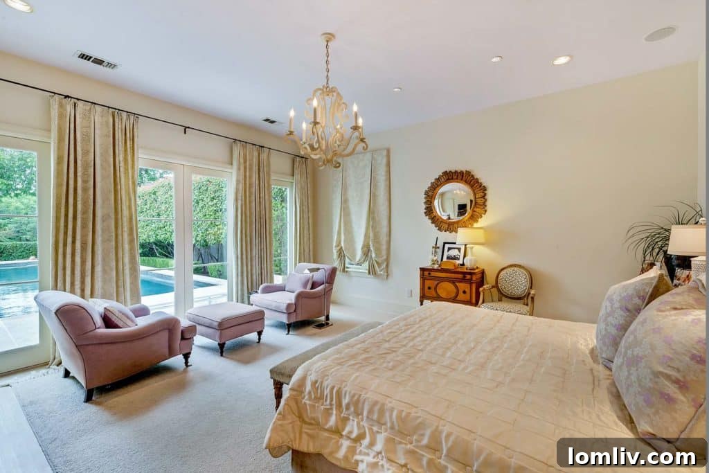 Serene master bedroom overlooking the symmetrically framed pool