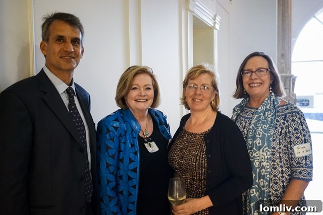 Sharon Quist and guests networking after Adrian Leeds' presentation