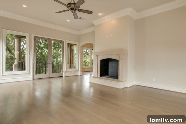 Upstairs Living Room with Elegant Fireplace and Forest Views