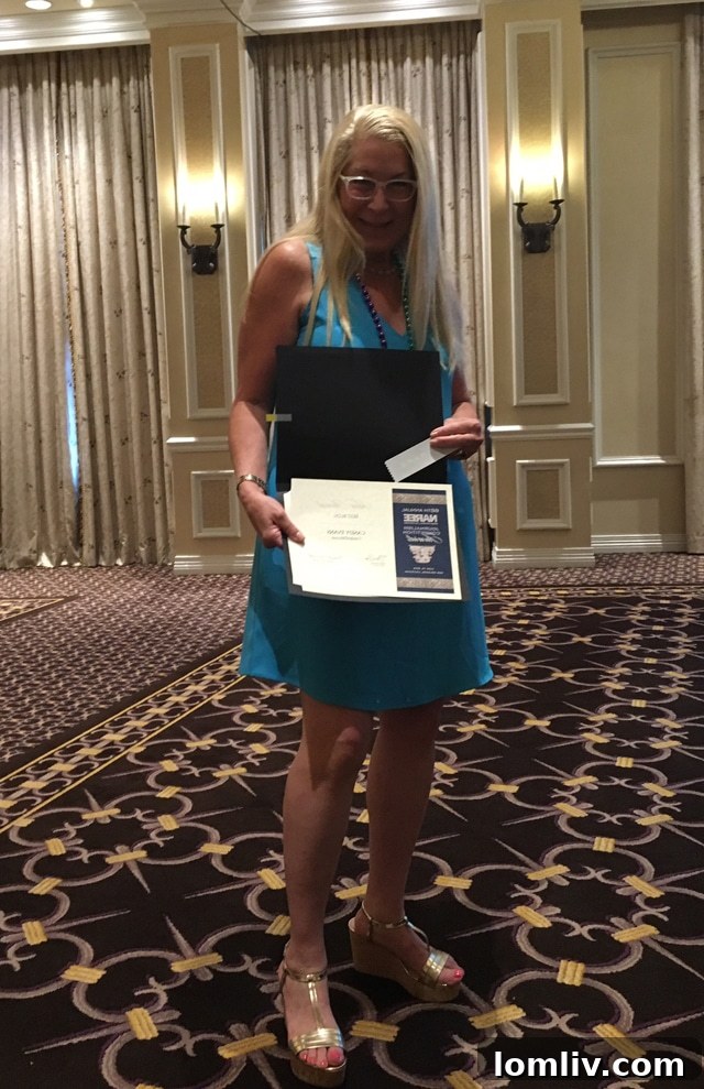 Candace Evans, Publisher of CandysMedia, receiving her Silver award for Best Blog for daltxrealestate.com and SecondShelters.com.