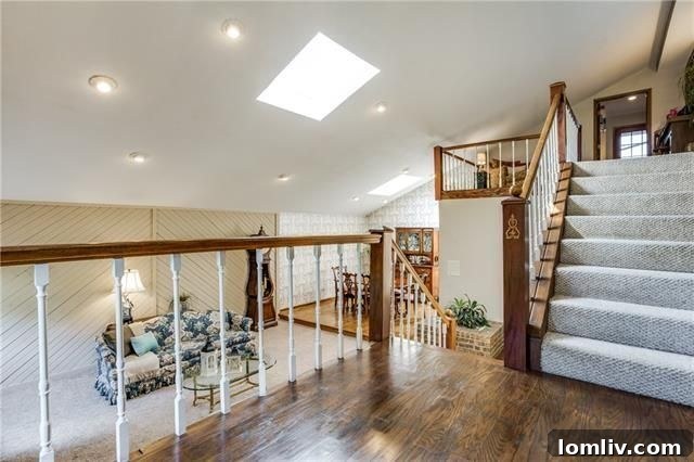 Entryway with soaring ceilings and grand staircase