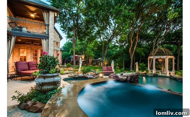 Multi-level swimming pool with slide and rock features at Frisco estate