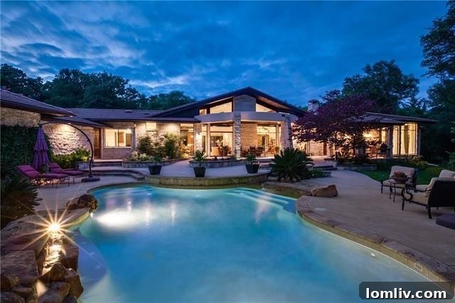 Elegant architect-designed home nestled in wooded Fort Worth landscape