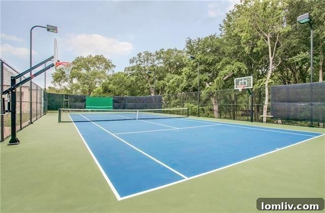 Expansive green lawn and mature trees behind Plano luxury property
