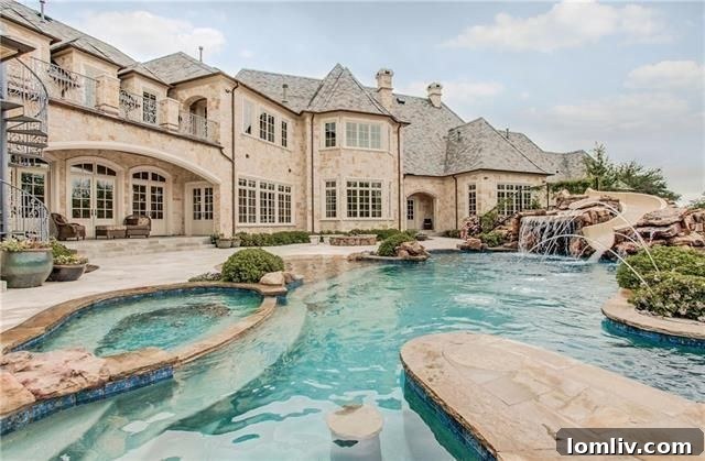Poolside entertainment area with covered patio at Plano estate