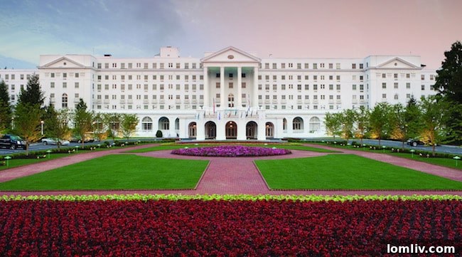 The Greenbrier, a historic luxury resort in White Sulphur Springs, West Virginia, with its iconic white facade and elegant architecture.