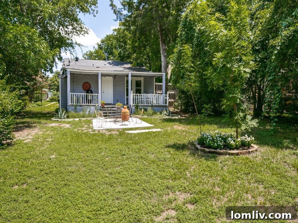 Overall view of the beautifully landscaped backyard of the home