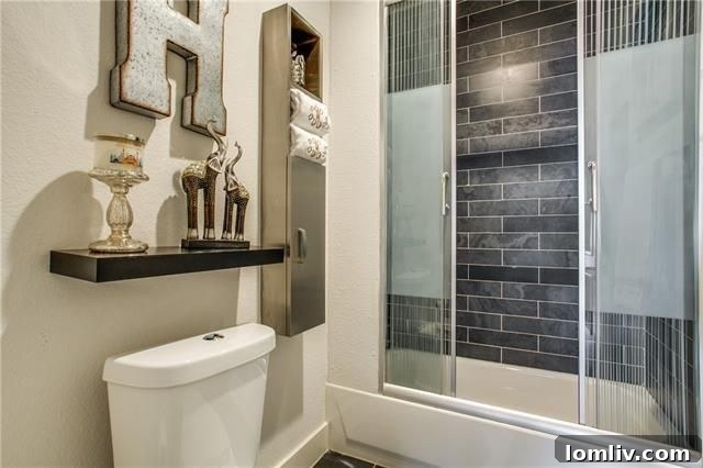 Well-Appointed Bedroom with Stylish Furnishings and Plush Carpeting