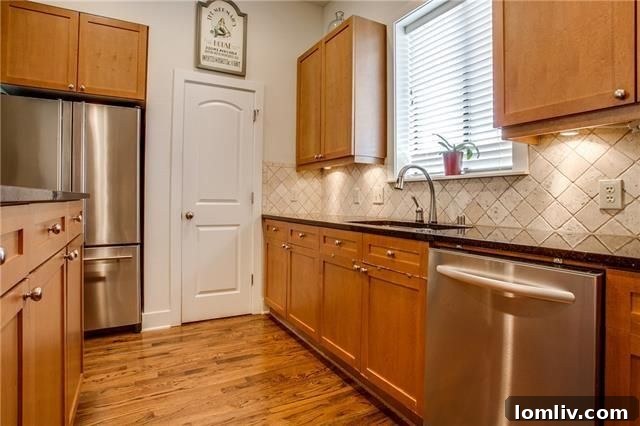Elegant kitchen with granite countertops and stainless steel appliances