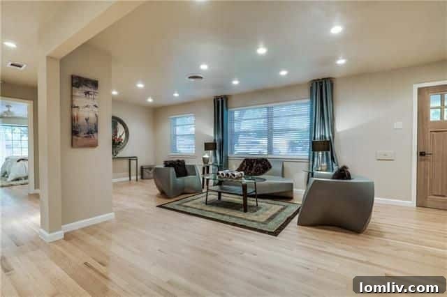 Open concept living room with mosaic fireplace