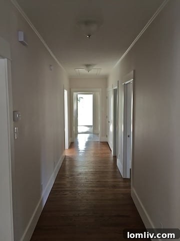 Newly renovated hallway in 2700 College Avenue, showing increased width and natural light